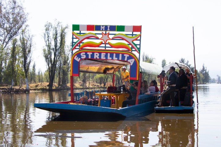 trajineras in the colourful canals of Xochimilco